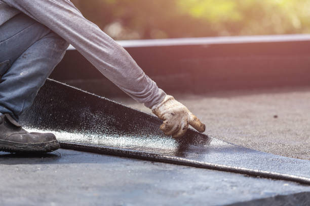 Professional Basement Waterproofing technician working in Marshfield Hills, MA